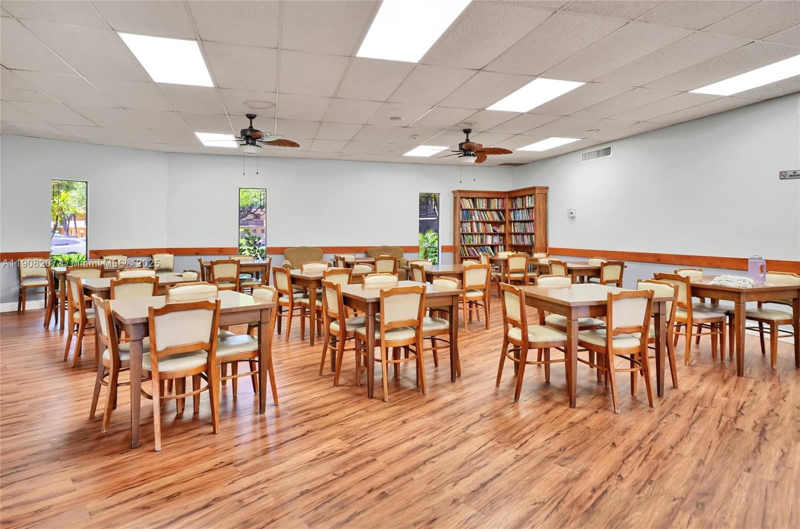 100 Ashbury Road, Unit 103 Hollywood, FL 33024 - Photo 21 of 28 a group of dining room with lots of furniture and wooden floor