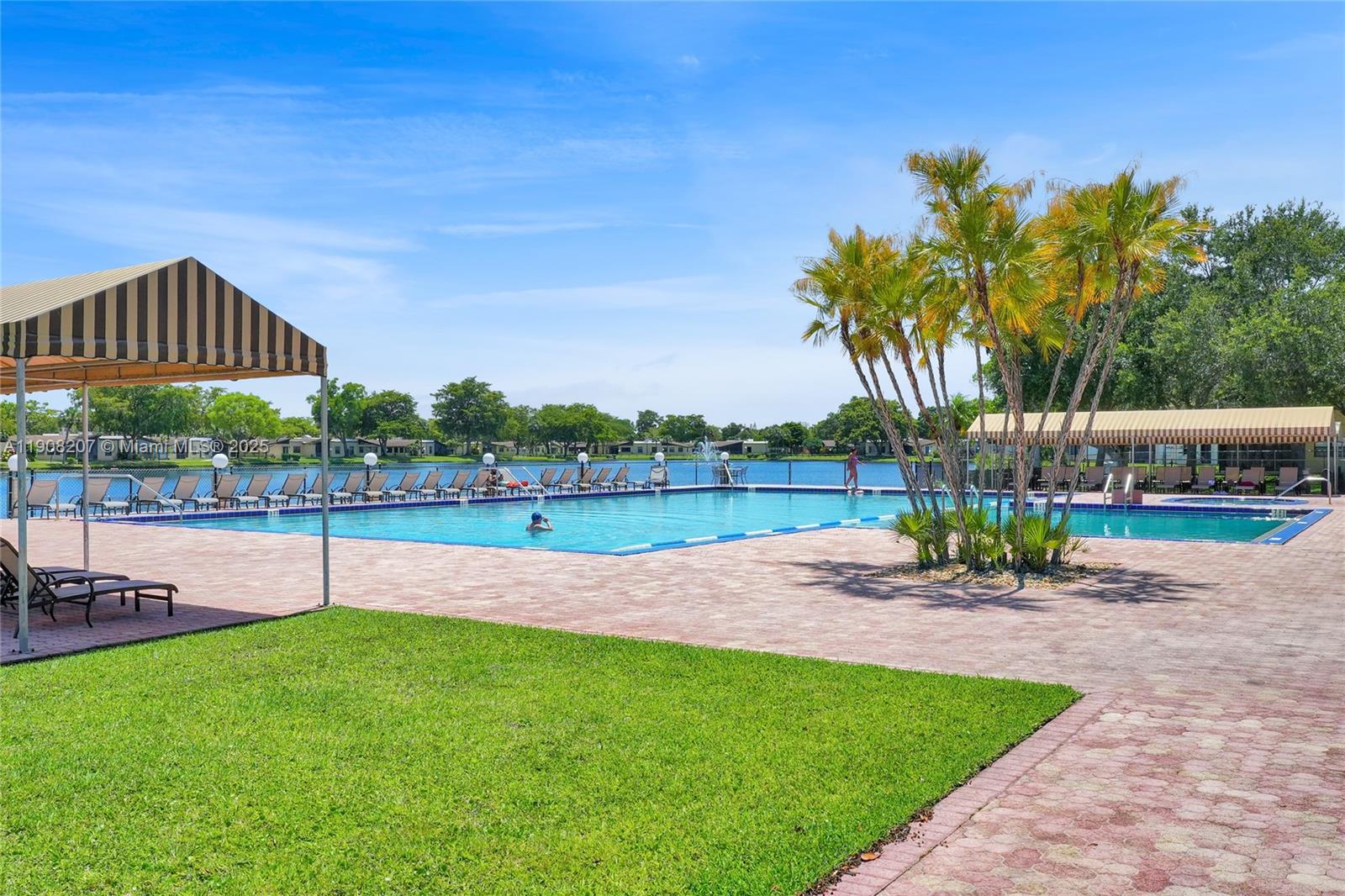 100 Ashbury Road, Unit 103 Hollywood, FL 33024 - Photo 22 of 28 a view of a garden with a slide area