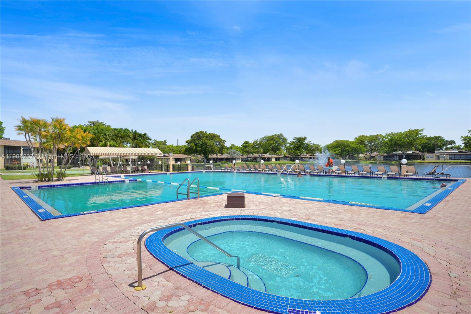 100 Ashbury Road, Unit 103 Hollywood, FL 33024 - Photo 27 of 28 a view of swimming pool with outdoor space and seating area
