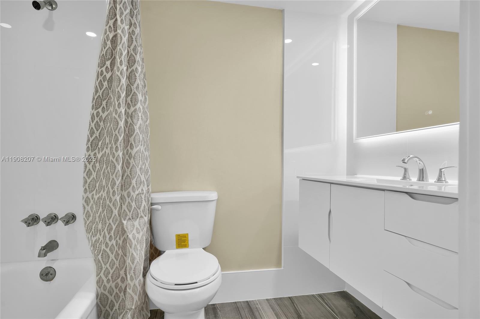 100 Ashbury Road, Unit 103 Hollywood, FL 33024 - Photo 10 of 28 a bathroom with a sink a toilet and shower