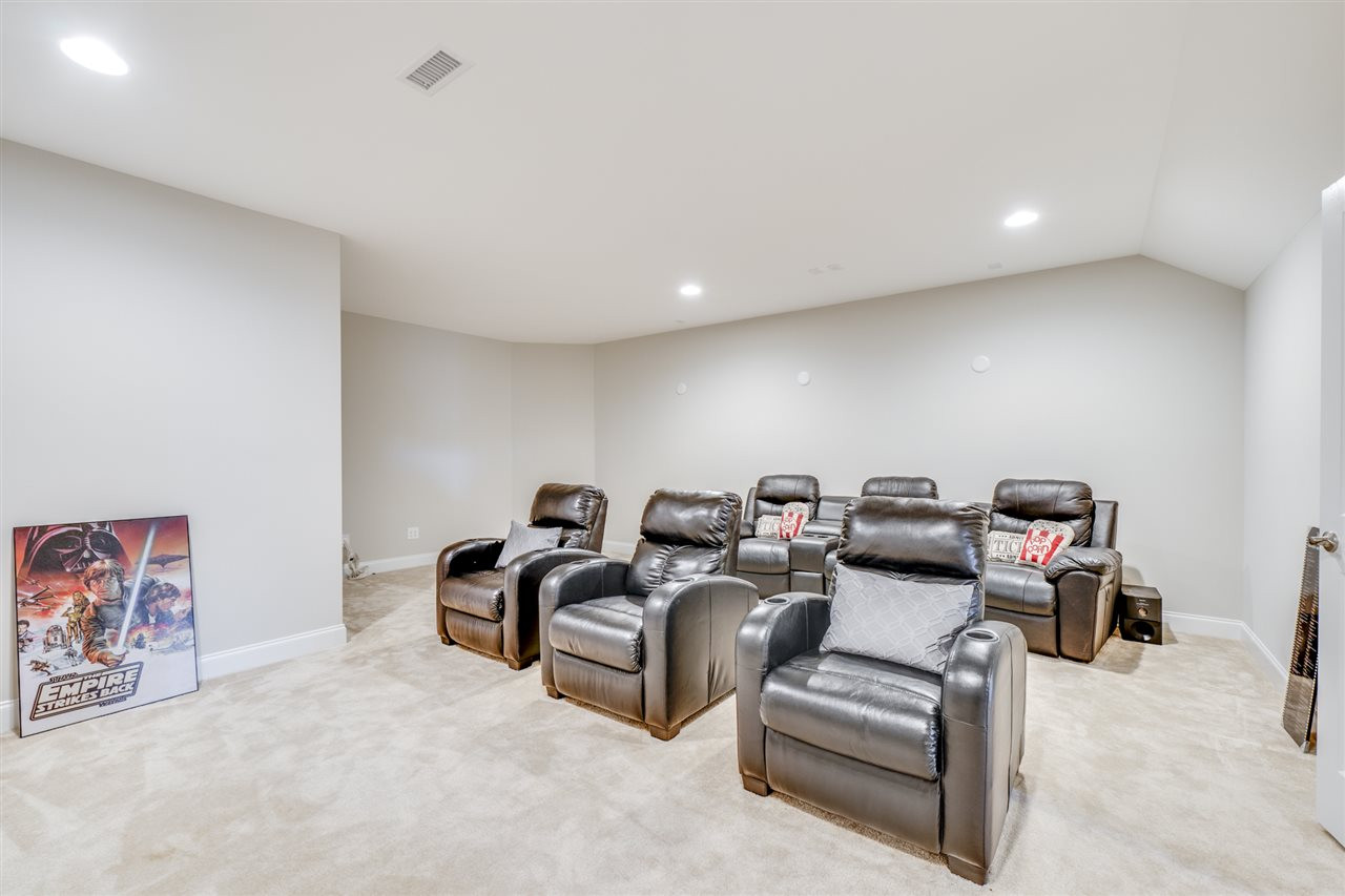 7504 Pinaster Place Raleigh, NC 27613 - Photo 27 of 30 Catch a movie or Sunday night football w/ your loved ones in this amazing, one of a kind media room! Media Room