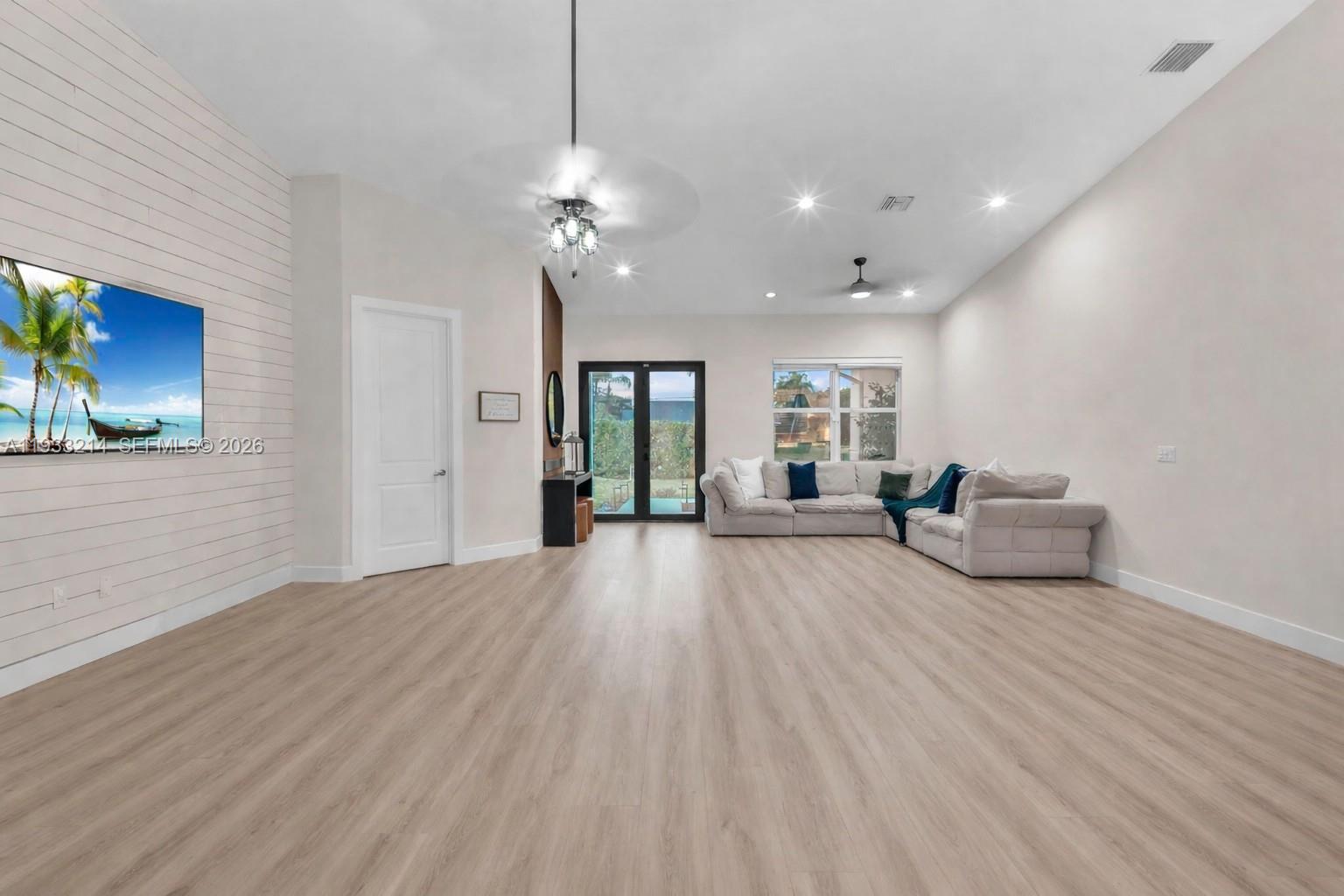 17844 38th Road North Loxahatchee, FL 33470 - Photo 16 of 66 a view of a livingroom with furniture a ceiling fan and window