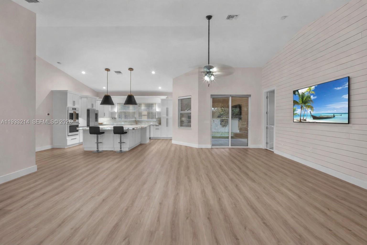 17844 38th Road North Loxahatchee, FL 33470 - Photo 18 of 66 a view of kitchen with cabinets and wooden floor