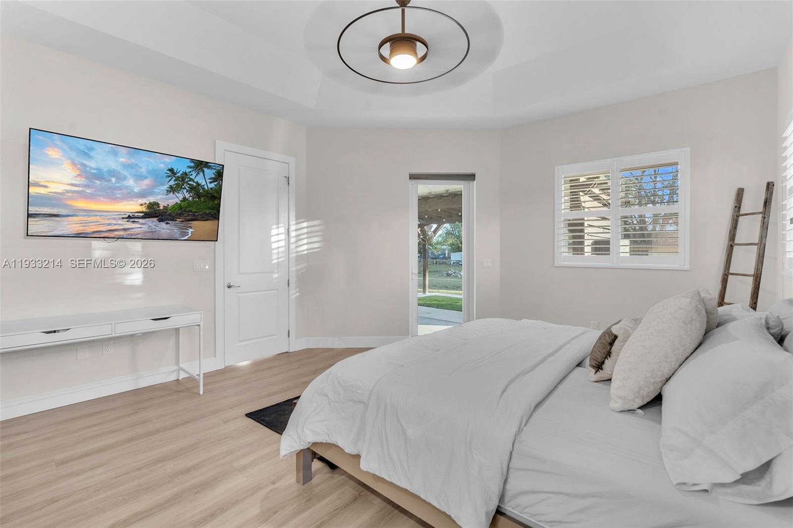 17844 38th Road North Loxahatchee, FL 33470 - Photo 20 of 66 a bedroom with a bed and a painting on the wall