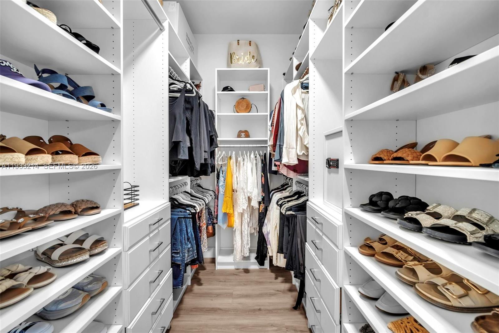 17844 38th Road North Loxahatchee, FL 33470 - Photo 22 of 66 a view of walk in closet with clothes and shoes