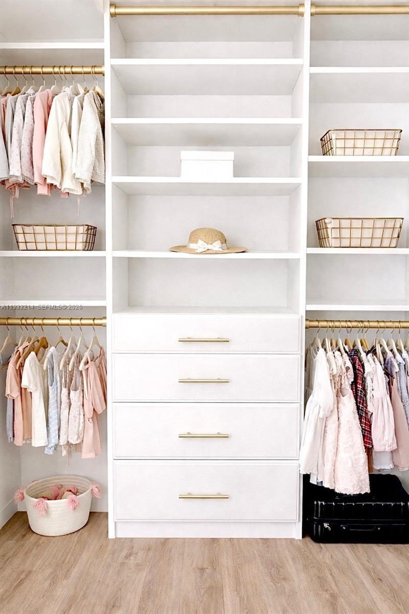 17844 38th Road North Loxahatchee, FL 33470 - Photo 26 of 66 a view of walk in closet with clothes and shoes