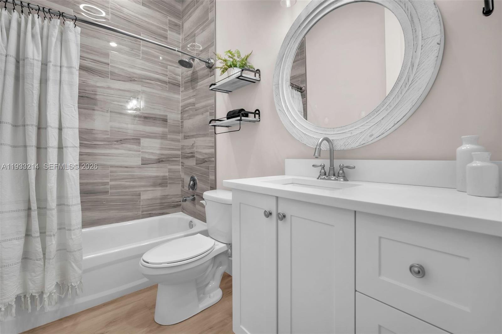 17844 38th Road North Loxahatchee, FL 33470 - Photo 29 of 66 a bathroom with a sink a toilet and shower