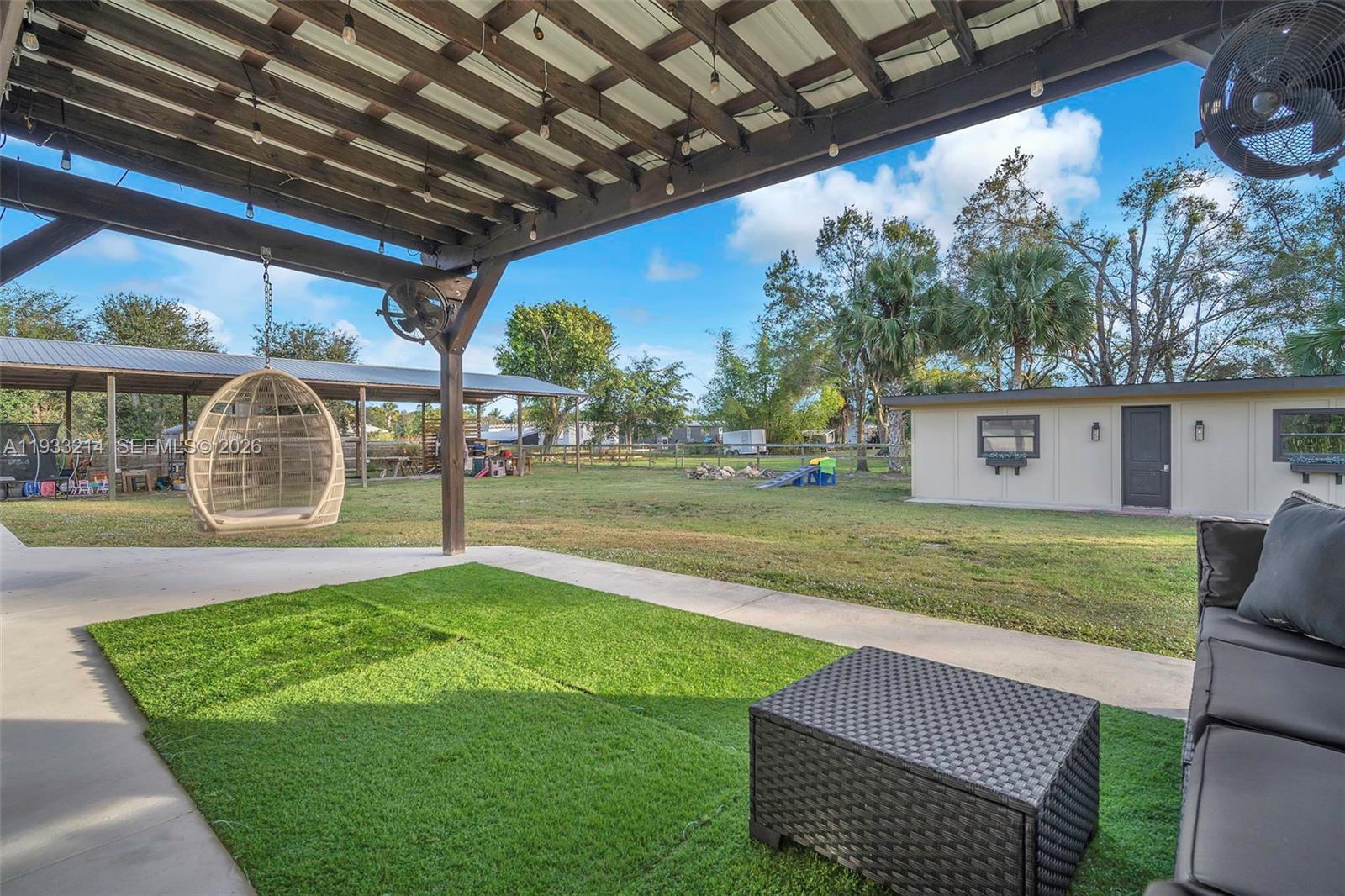 17844 38th Road North Loxahatchee, FL 33470 - Photo 33 of 66 a view of a backyard with a garden