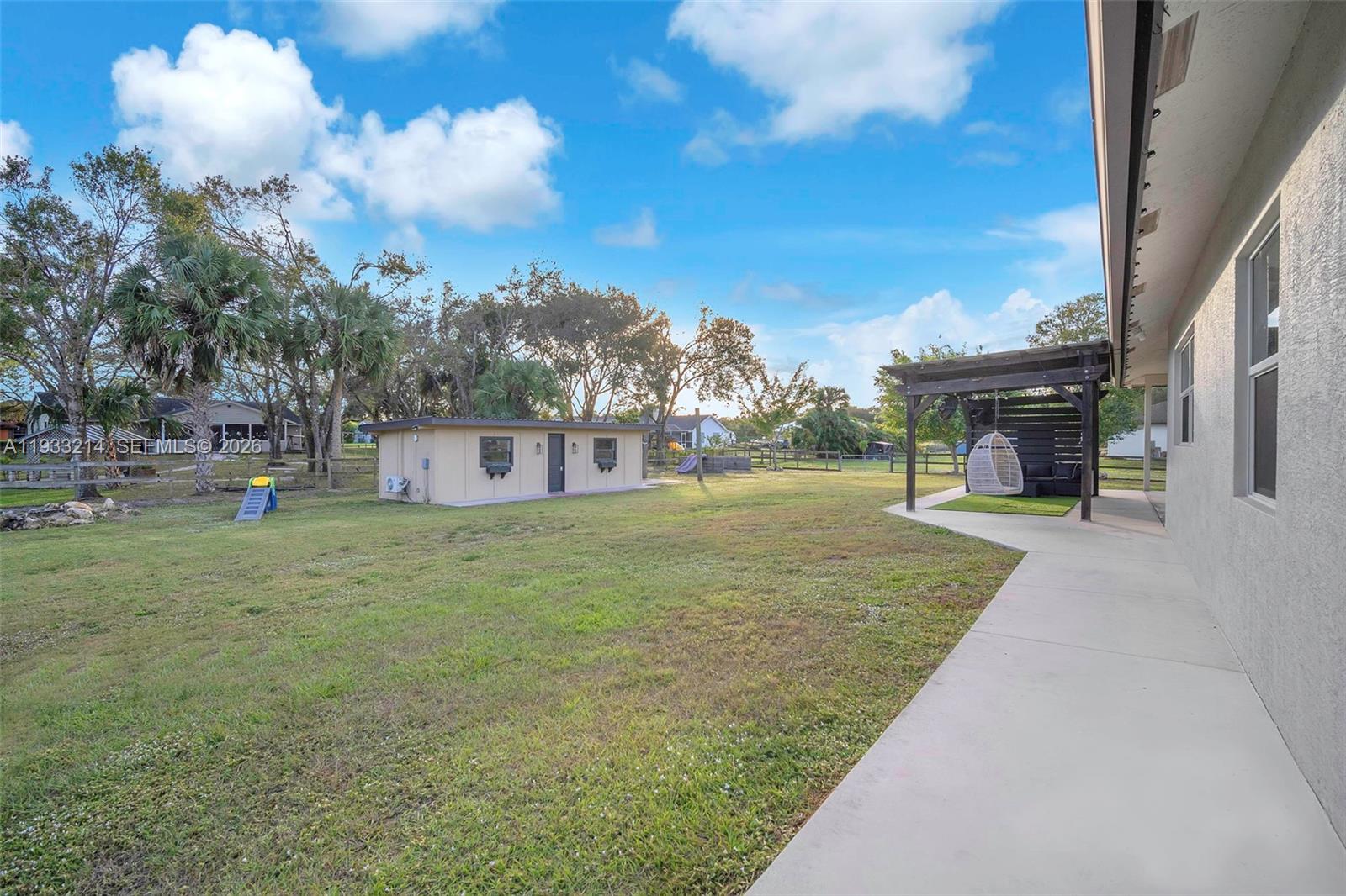 17844 38th Road North Loxahatchee, FL 33470 - Photo 35 of 66 a view of a house with a yard