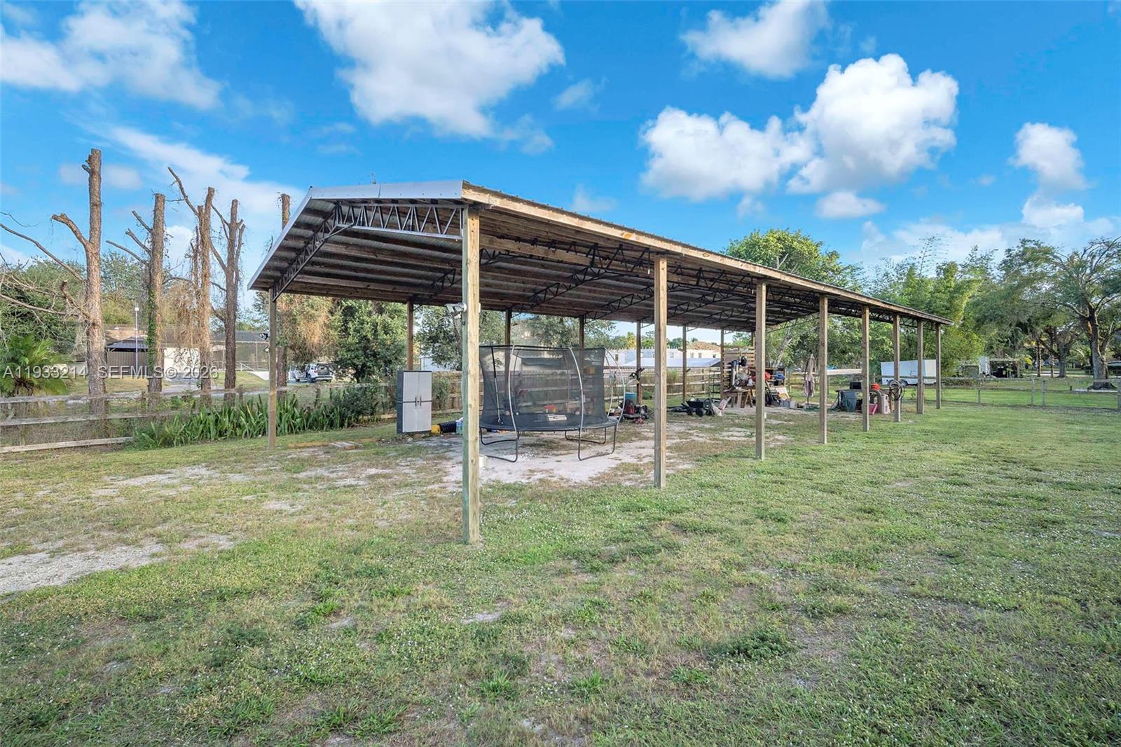 17844 38th Road North Loxahatchee, FL 33470 - Photo 41 of 66 a view of a house with a backyard