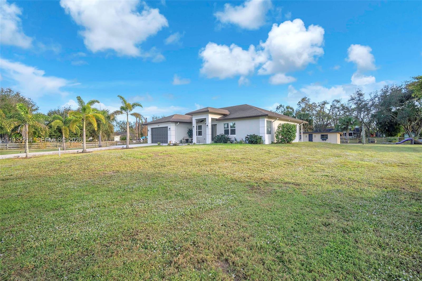 17844 38th Road North Loxahatchee, FL 33470 - Photo 42 of 66 a view of a house with a big yard