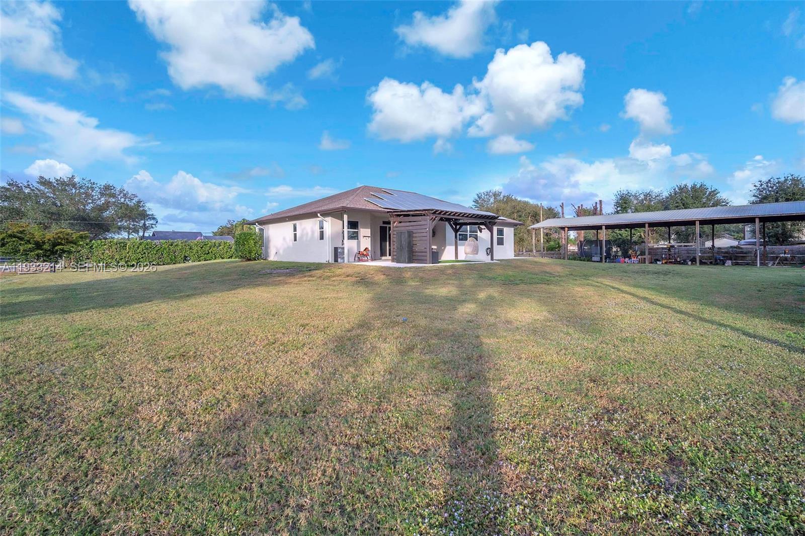17844 38th Road North Loxahatchee, FL 33470 - Photo 43 of 66 a view of a house with a yard