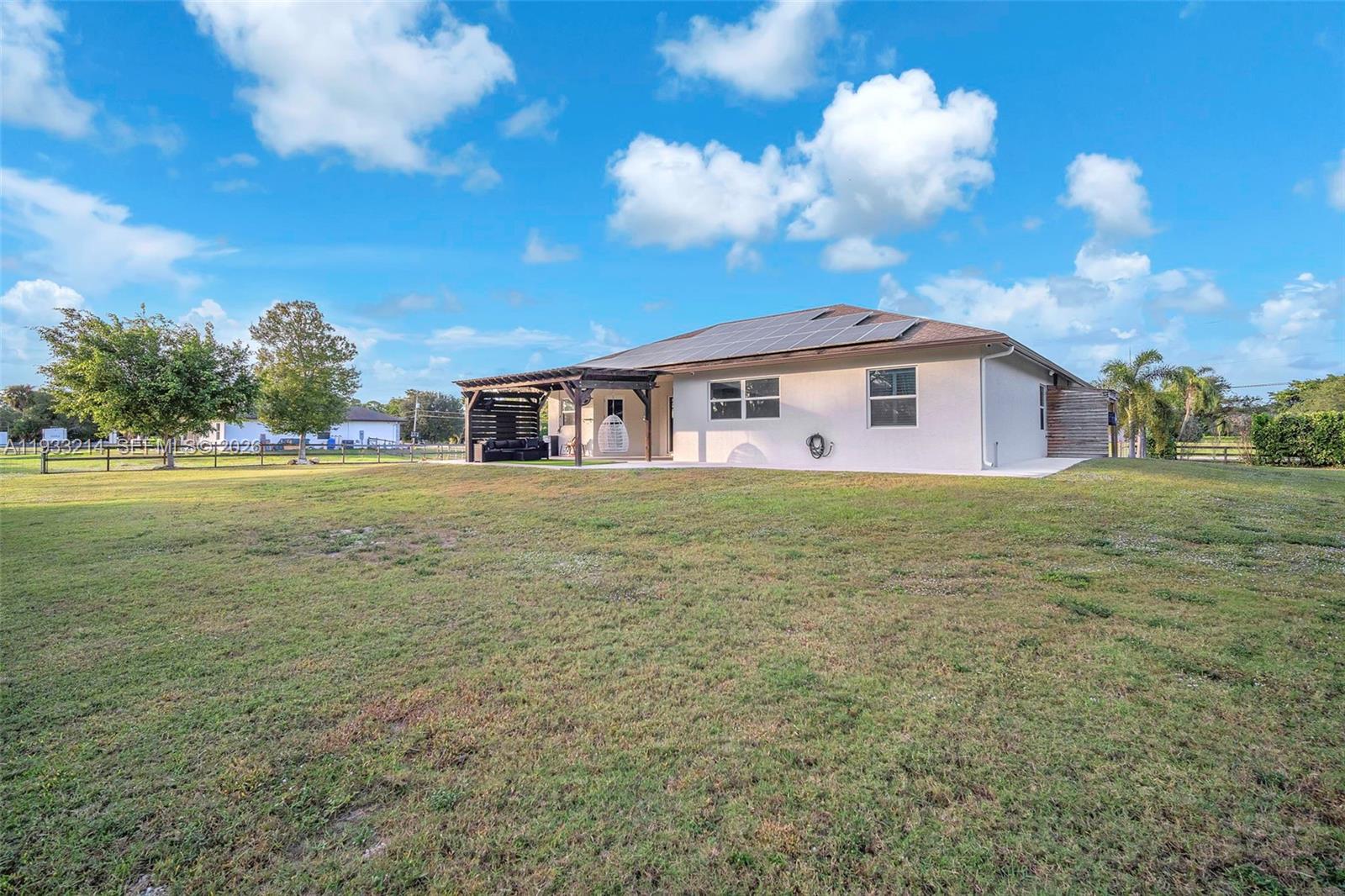 17844 38th Road North Loxahatchee, FL 33470 - Photo 45 of 66 a view of a house with a yard