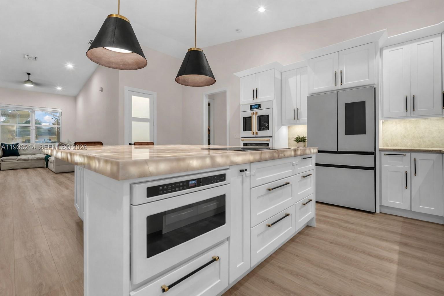 17844 38th Road North Loxahatchee, FL 33470 - Photo 5 of 66 a kitchen with stainless steel appliances a stove a sink and a refrigerator