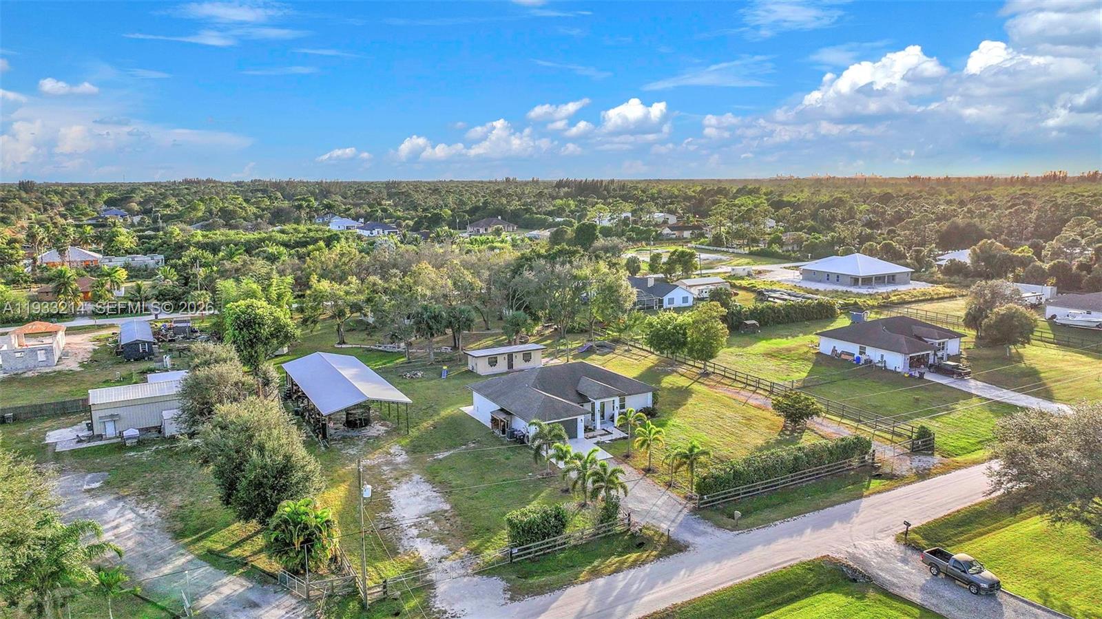 17844 38th Road North Loxahatchee, FL 33470 - Photo 51 of 66 an aerial view of residential houses with outdoor space