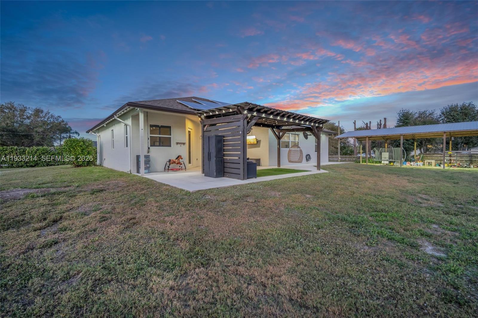 17844 38th Road North Loxahatchee, FL 33470 - Photo 61 of 66 a view of a house with a big yard and large trees