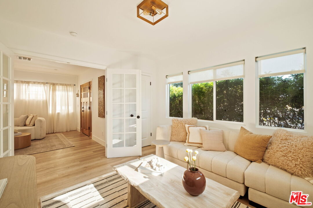 2831 South Corning Street Los Angeles, CA 90034 - Photo 20 of 41 a living room with furniture and a large window