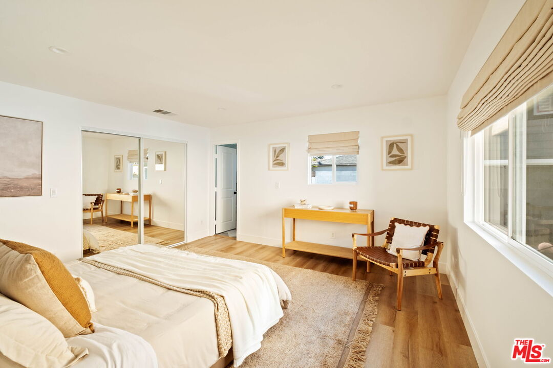 2831 South Corning Street Los Angeles, CA 90034 - Photo 23 of 41 a bedroom with a bed and wooden floor