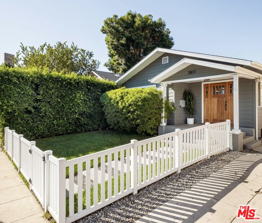 2831 South Corning Street Los Angeles, CA 90034 - Photo 3 of 41 a view of a house with wooden fence