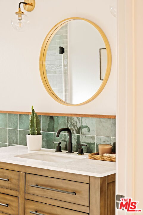 2831 South Corning Street Los Angeles, CA 90034 - Photo 32 of 41 a bathroom with a sink and a mirror