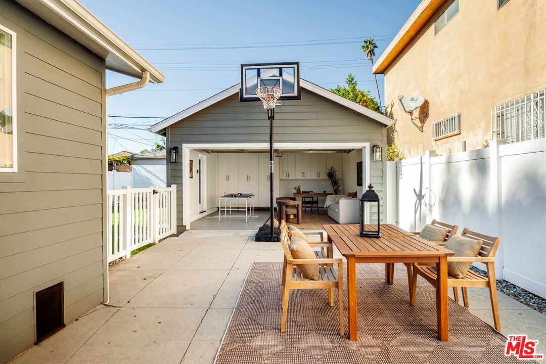 2831 South Corning Street Los Angeles, CA 90034 - Photo 35 of 41 a view of a patio with table and chairs and potted plants