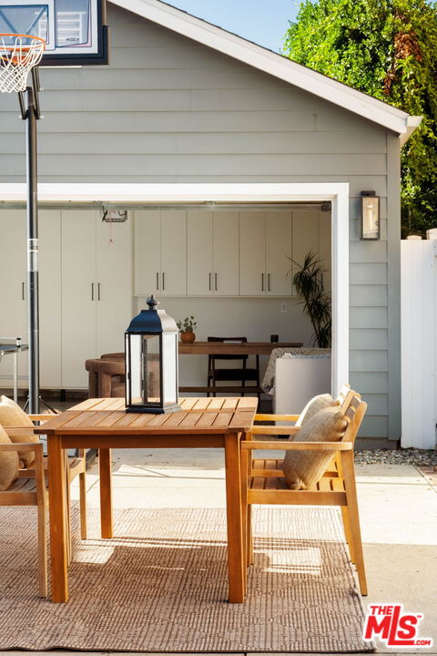 2831 South Corning Street Los Angeles, CA 90034 - Photo 36 of 41 a view of a dinning tables and chair in the balcony