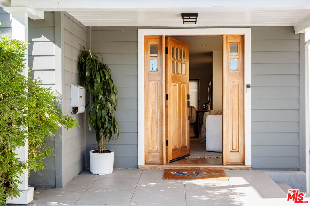 2831 South Corning Street Los Angeles, CA 90034 - Photo 4 of 41 a potted plant sitting in front of a door