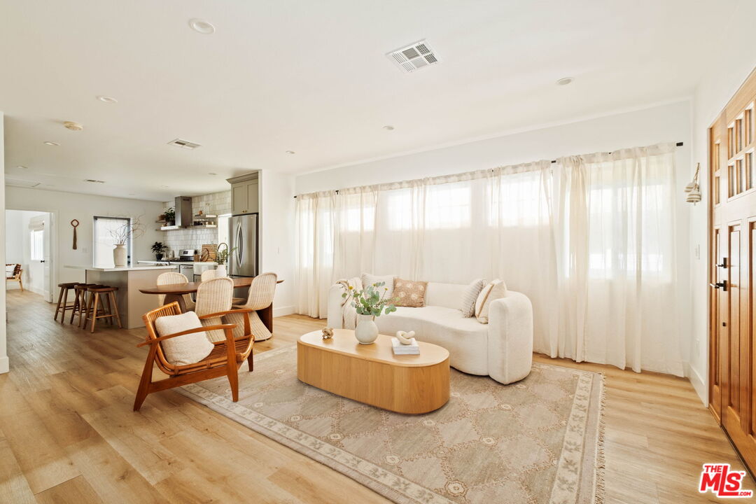 2831 South Corning Street Los Angeles, CA 90034 - Photo 8 of 41 a living room with furniture and a large window