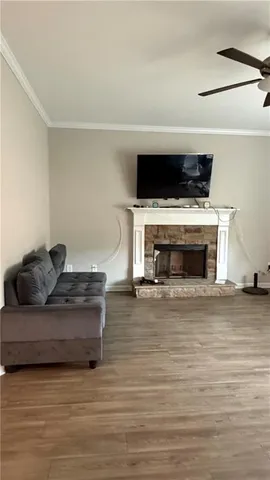 a living room with furniture and a fireplace