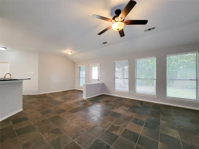 a view of an empty room with a window