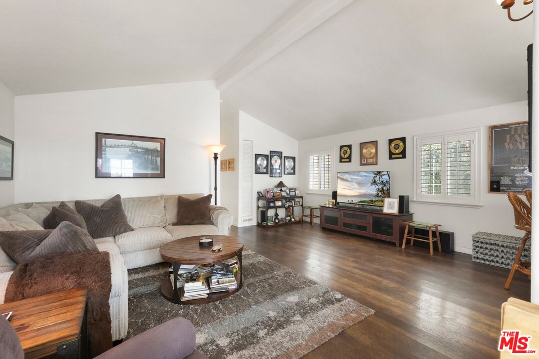31 Paradise Cove Road Malibu, CA 90265 - Photo 12 of 27 a living room with furniture or couch and a wooden floor