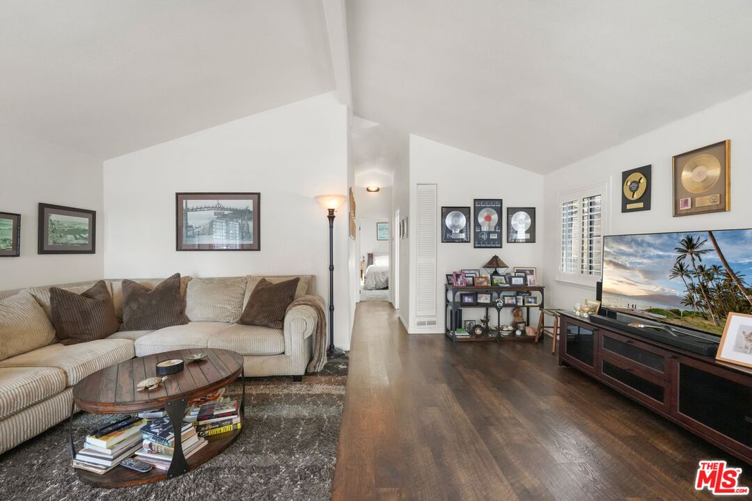 31 Paradise Cove Road Malibu, CA 90265 - Photo 13 of 27 a living room with furniture and wooden floor