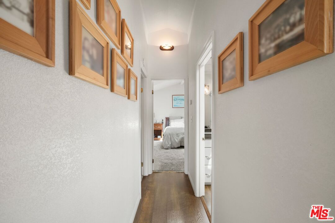 31 Paradise Cove Road Malibu, CA 90265 - Photo 17 of 27 a view of a hallway with wooden floor and cabinet
