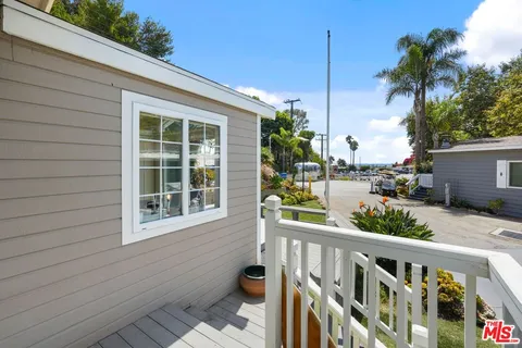 a view of a balcony with potted plants