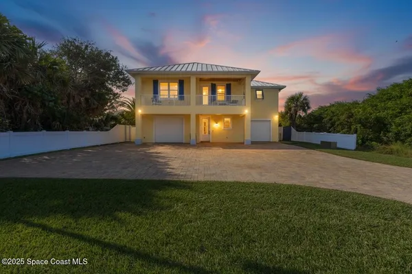 a view of a big house with a big yard