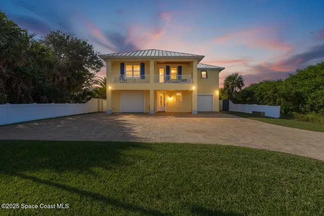 a view of a big house with a big yard