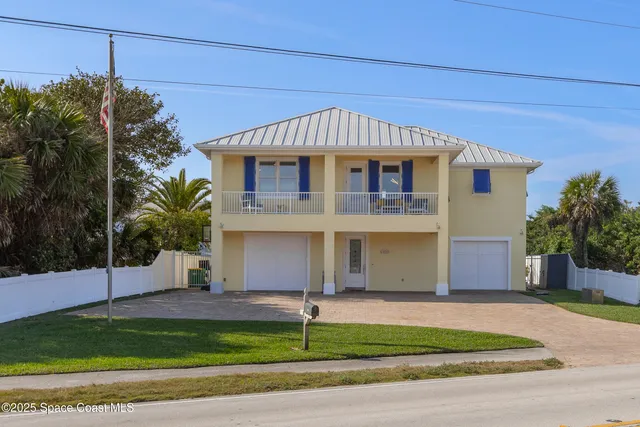 a view of a house with a big yard