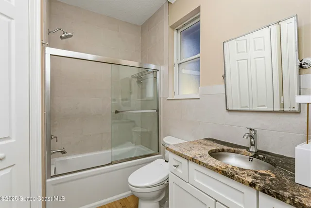 a outdoor space with a couch and wooden floor