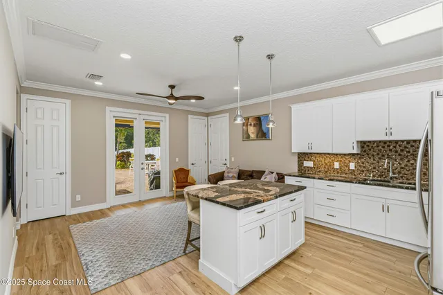 a kitchen with stainless steel appliances granite countertop a stove and a refrigerator