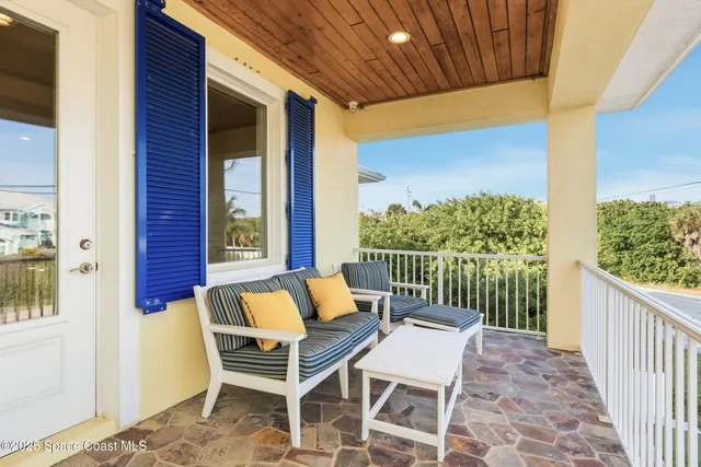 a view of a kitchen with kitchen island and stainless steel appliances