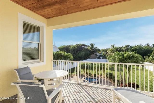 a kitchen with stainless steel appliances kitchen island granite countertop a refrigerator and microwave
