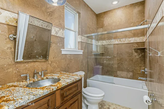 a view of a livingroom with furniture and staircase