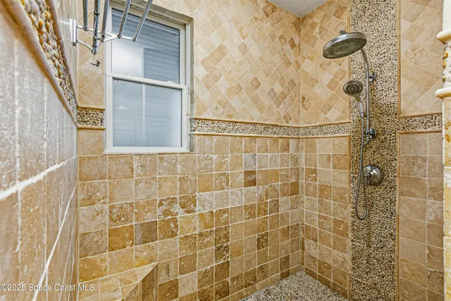 a front view of house with a yard and balcony