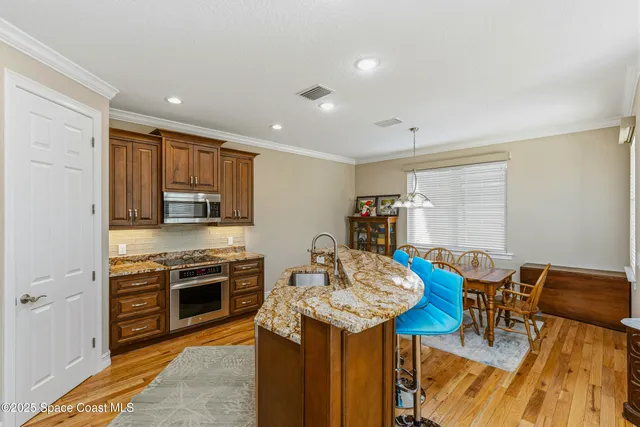 an aerial view of a house with a yard basket ball court and outdoor seating
