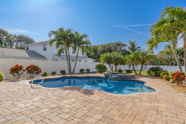 a view of a swimming pool with a patio