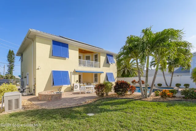 a swimming pool with outdoor seating