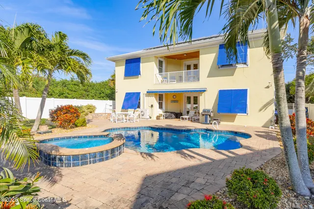 a front view of house with yard and outdoor seating