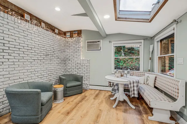 a bedroom with furniture and a chandelier