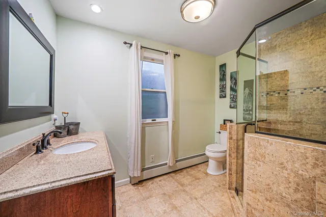 a bathroom with a shower and a toilet