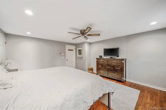 a bedroom with a bed and cabinets